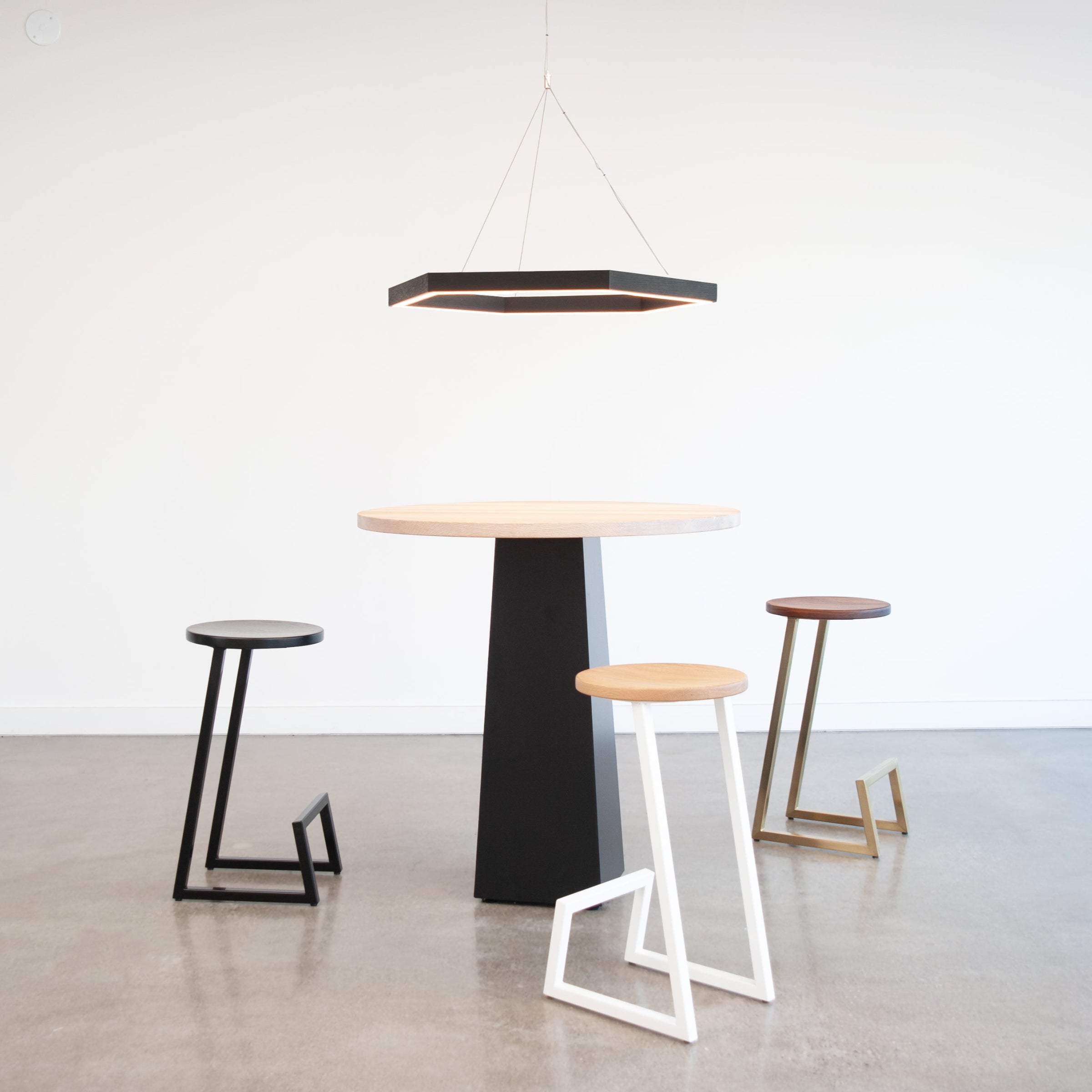 hollis morris hexagon chandelier brockton table corktown stool